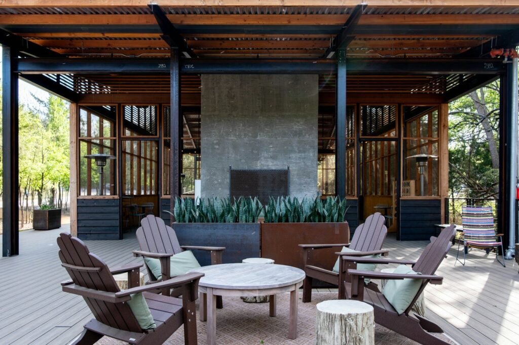 Covered patio with outdoor stone fireplace and seating