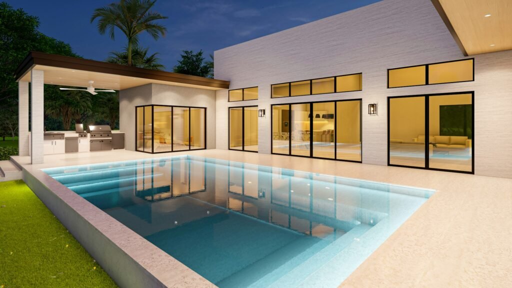 Contemporary home with rectangular pool and glass walls at dusk