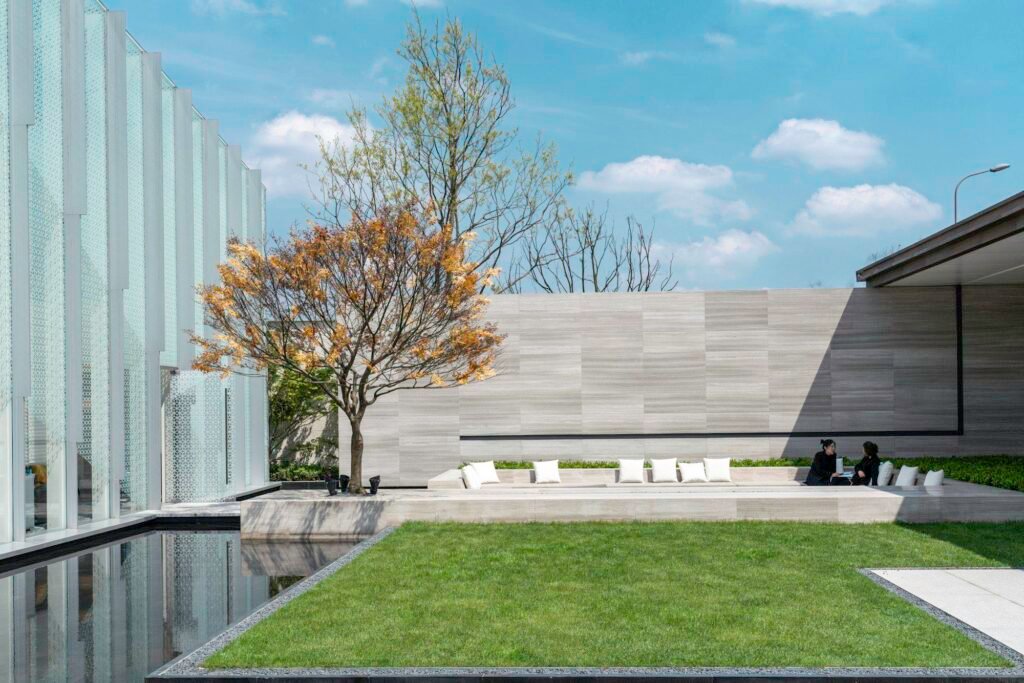 Manicured green lawn panel in a modern minimalist courtyard